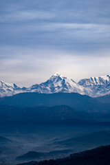 Fototapeta na wymiar Himalayan Peaks covered in snow, a view from Kausani, switzerland of India.