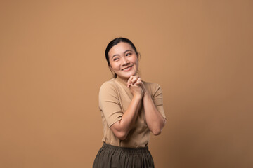 Woman in love isolated on beige background.