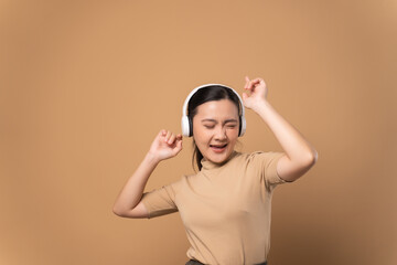 Happy woman with headphones and listening to music.