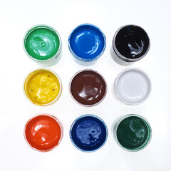 Paints, nine jars with colorful paints on a white background ... 