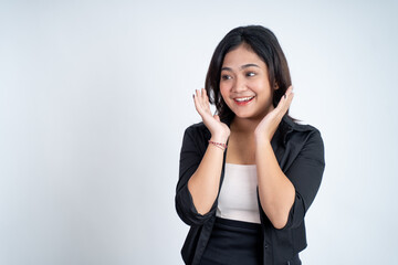 Excited young asian woman opening two palms while smiling