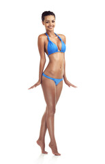 Fototapeta premium Bring it on summer. Studio shot of a beautiful brunette model in a bikini isolated on white.