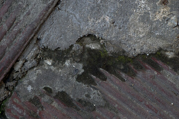 cracked cement covered with gray cement surface as background for design