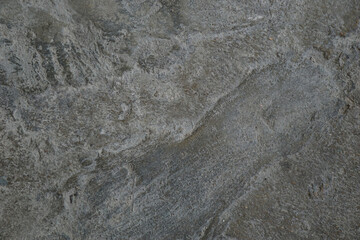 cracked cement covered with gray cement surface as background for design