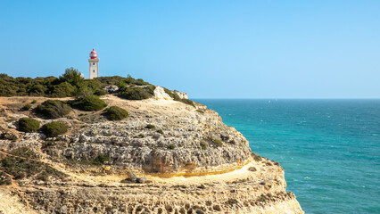 Algarve- region in Portugal- rock,  lighthouse and atlantic ocean