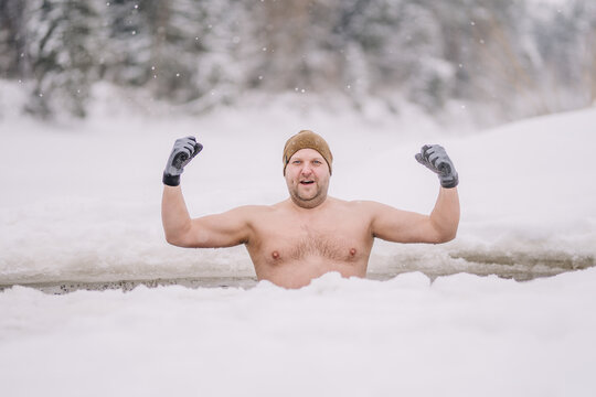 winter hardening therapy, ice cold bath in the river
man in the best years