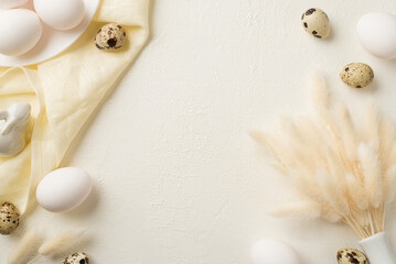 Top view photo of easter decorations white vase with lagurus flowers plate ceramic rabbit quail eggs and cloth on isolated white background with copyspace