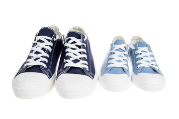 Big and small shoes, sneakers, isolated on white