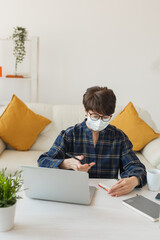 Online training education and freelance work. Computer, laptop and middle aged woman works remotely. Coronavirus pandemic in the world. Lock down