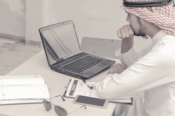 Muslim businessman who sitting at the office in feeling sad because his business failed and unemployed. Business failed concept.