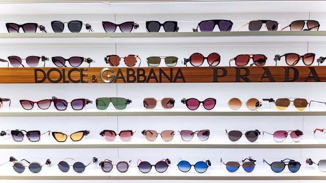 SPAIN, BARCELONA, MARCH, 2022 - Display of sunglasses with multicolored glasses fashion manufacturers in Barcelona
