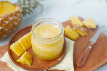 Iced pineapple juice in a glass, sliced ​​pineapple. (hea…