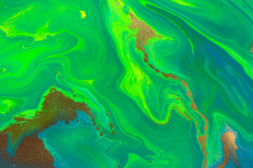 Fototapeta na wymiar Gold spots on flow green paints background. Abstract green print