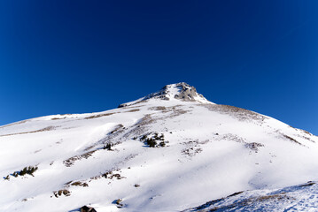 Aerial view of mountain panorama at the Swiss Alps seen from ski resort Engelberg, focus on...