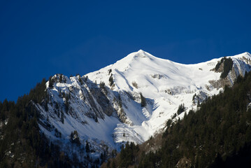 Aerial view of mountain panorama at the Swiss Alps seen from ski resort Engelberg, focus on...