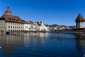 Fototapeta na wymiar Cityscape of medieval old town of Luzern with river Reuss on a sunny winter day. Photo taken February 9th, 2022, Lucerne, Switzerland.