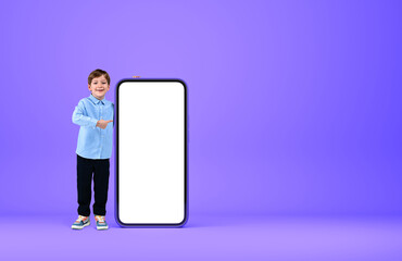A child point at phone mockup display on bright background