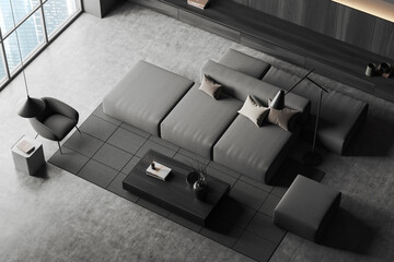 Top view of grey living room interior with sofa and armchair, window