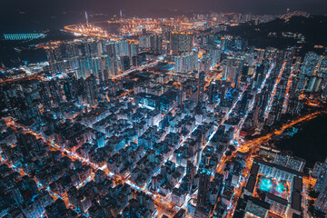 Fototapeta na wymiar Aerial view of intersection in Hong Kong Downtown. Financial district and business centers in smart city, technology concept. Top view of buildings at night.