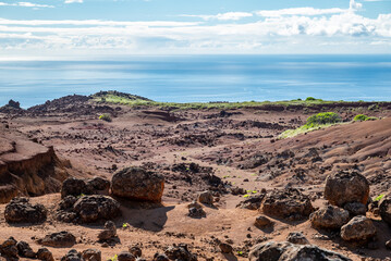 A view across a dry landscape, covered with lava rock, in the Garden of the Gods on Lanai, shows a...