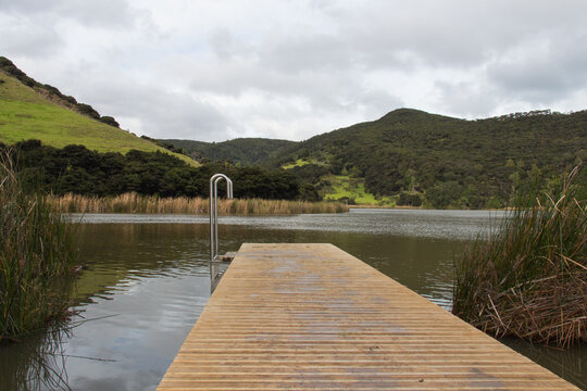 Wooden deck at lake Wainamu, New Zealand.