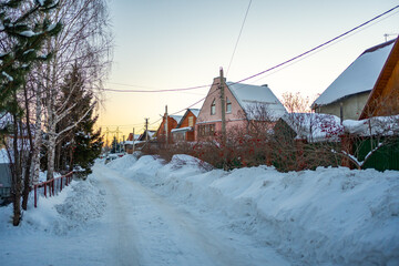 Winter orange sunset in the village near Kemerovo, Siberia, Russia