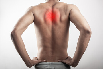 man stretching his back due to pain in spinal cord, rhomboid muscle, scapula