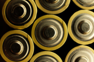 Closeup of the positive pole on an alkaline battery