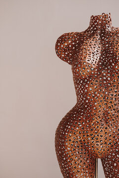 Metal brass, copper woman mannequin. Aesthetic minimal fashion art