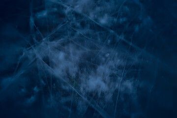 blue ice glass background, abstract texture of the surface of the ice on the glass, frozen seasonal water