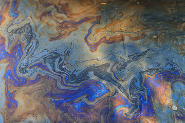 Naklejka premium spilled gasoline rainbow background, industrial hazard spill pollution, abstract texture multicolored