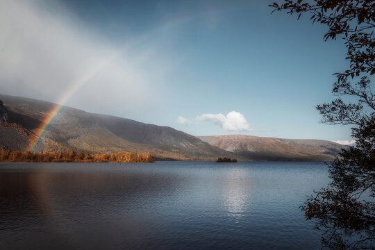 rainbow on over the lake in autumn