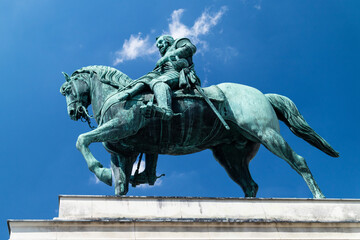 Equestrian statue with rider viewed from below