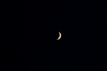 Obraz na płótnie Canvas Centered crescent moon in night sky