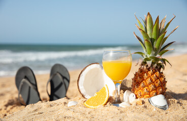 fruit juice cocktail on the beach- summer holiday concept