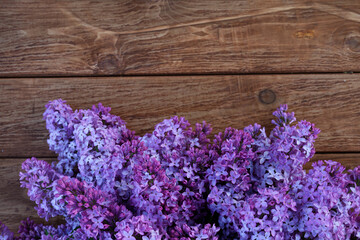 lac flowers in bloom on wooden table. Spring concept. Copy space. Top view. Spring concept