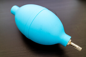 Little blue rubber manual air pump