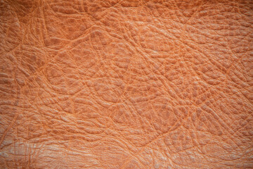 Genuine leather texture background. Dark brown, orange textures for decoration blank. Vintage skin natural suede.