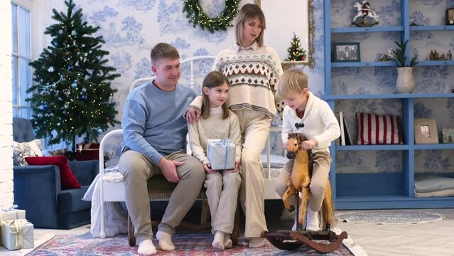 A family of four spend time together.