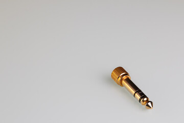 copper audio system adapter on a white background