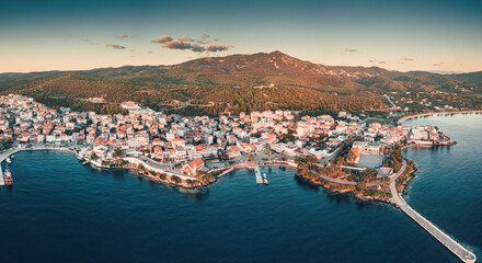 Wide aerial panoramic sunset view of a resort sea town Neos Marmaras in Halkidiki, Sithonia. Travel...