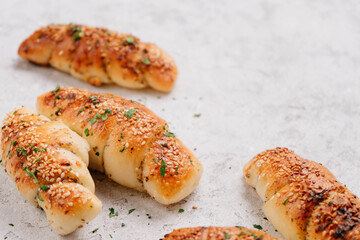 Fresh baked garlic buns with seasame vertical