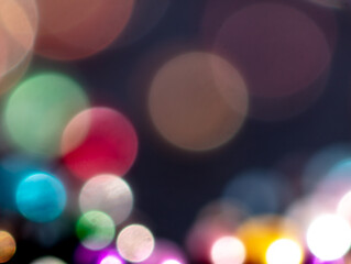 Multicolored festive bokeh as background.