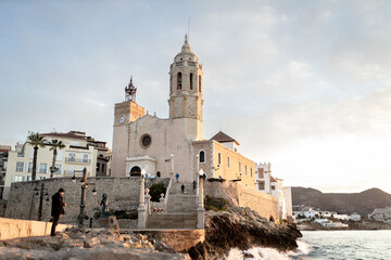 Fototapeta na wymiar Old church and landmark in Sitges, Spain. Church of Sant Bartomeu & Santa Tecla.