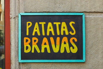 Patatas Bravas sign outside a restaurant in Barcelona, Spain