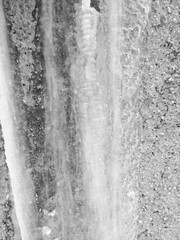 Icicles on the wall of the house as a background.