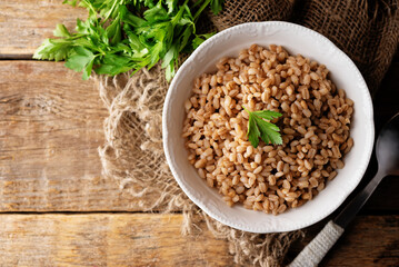 Barley porridge with banana slices and almond