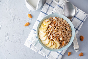 Barley porridge with banana slices and almond