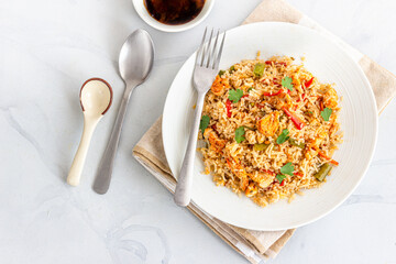 Non Vegetarian Fried Rice in a Plate on White Background Directly Above
