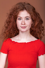 Portrait of a young beautiful red hair girl